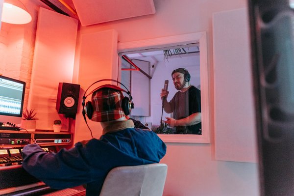 What are the ideal materials for building a soundproof home music studio in the UK?